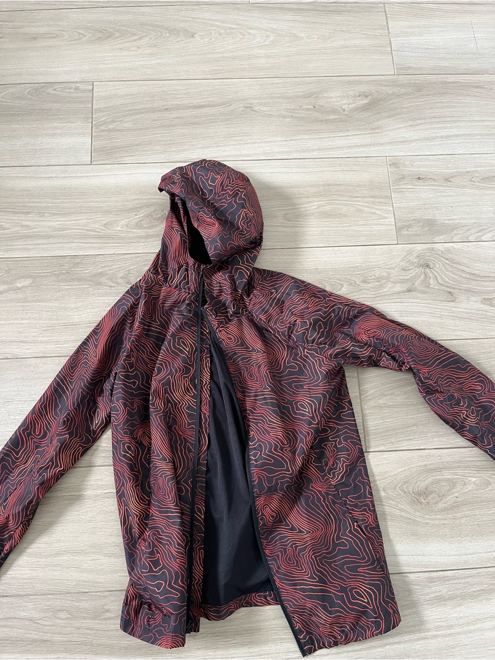 Kids all in motion red  & Black Topographic Hooded rain jacket